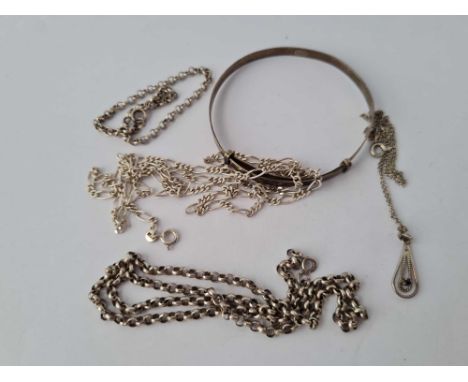 A silver bangle and chains