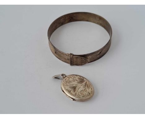A silver locket and bangle 23 gms