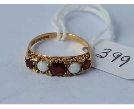A garnet and opal ring 9ct size O 2.5 gms