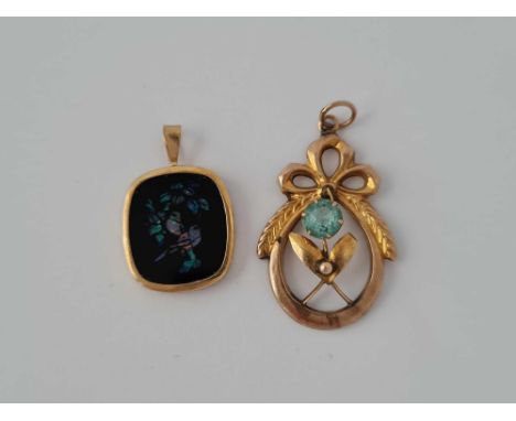 A gold blue stone pendant and a opal example