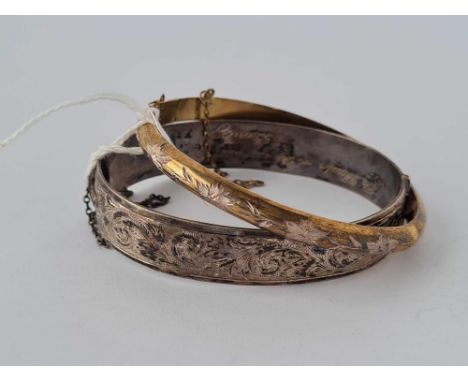 A silver bangle and silver gilt bangle