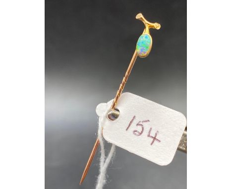 A antique fine fiery opal green blue and orange flashes stick pin in high carat