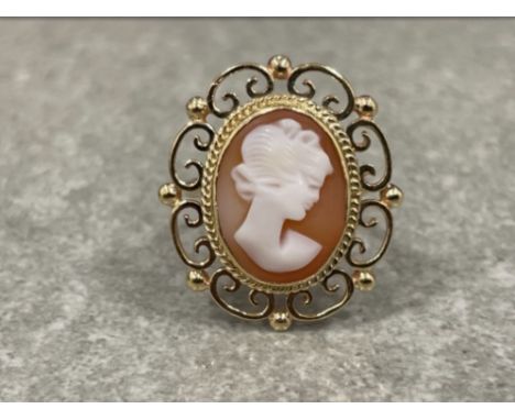 Ladies gold Cameo ring. Comprising of a cameo lady set with ornate scroll edge. 5.5G size N
