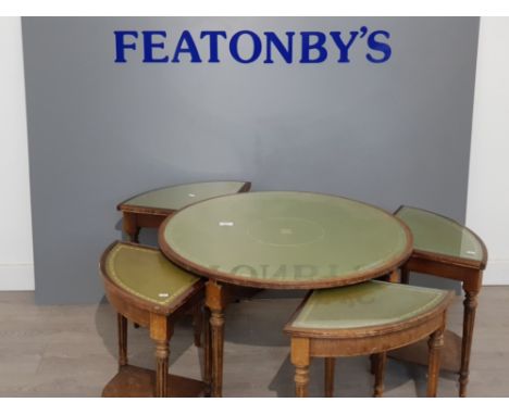 Circular vintage table,topped with green leather along with 4 matching nest of tables also green leather topped