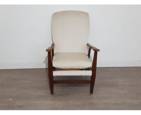 Vintage mahogany framed upholstered armchair with a cream fabric