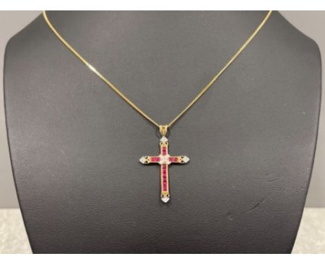 Ladies 9ct gold Ruby and Diamond cross pendant and chain. Featuring 12 princess cut Rubies and diamonds on all cross ends