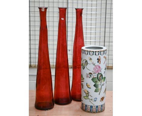 A Chinese porcelain cylindrical stick stand painted with fruit, flowers and insects, 63 cm high to/w three large red gass vas