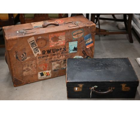 A large vintage leather suitcase with various labels including Cunard White Star First Class and various European hotels to/w
