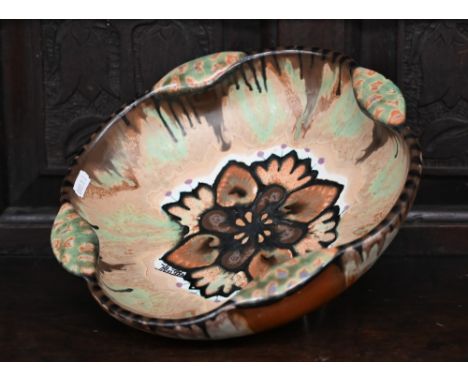 A Paul Fouillen (Quimper) design studio pottery bowl with floral motif and streaked and marbled glaze, signed, 28 cm diam 