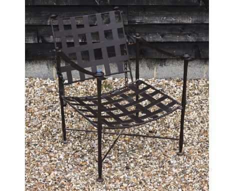 A wrought iron Bugatti style indoor/outdoor reclining armchair with lattice seat and chain supported adjustable back c/w seat