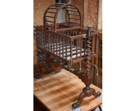 A Victorian mahogany bobbin and barley-twist turned swinging cradle, with part canopy top, a/f 