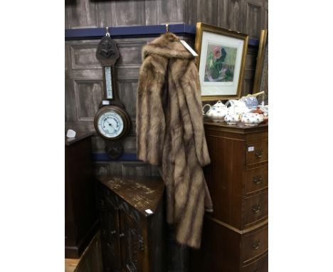 TWO MID 20TH CENTURY FUR COATS, one dark, the other light, both full length, one with purchase receipt
