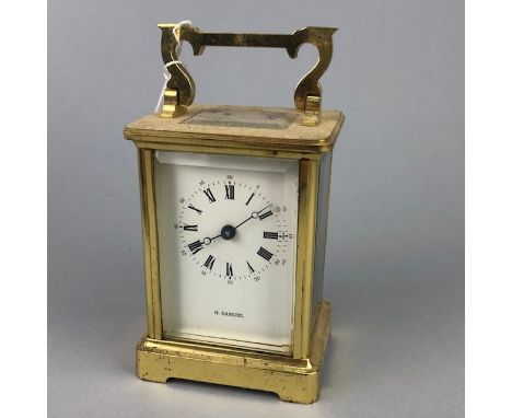 MODERN BRASS CARRIAGE CLOCK, the white dial with Roman numerals in black, 15cm high