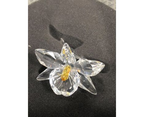 FOUR SWAROVSKI CRYSTAL FLOWERS, comprising The Orchid Pink, Deep Yellow, Light Yellow and a rose, all in original boxes