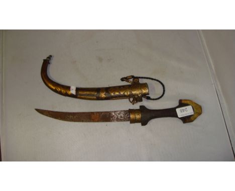 Vintage Jambiya with wood and metal handle in engraved brass scabbard overall length 43 cms