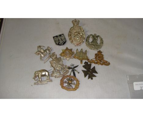 12 x Assorted Military badges including German Afrika Corps helmet badge, 2 SAS Artists uniform badge, South Lancashire Princ