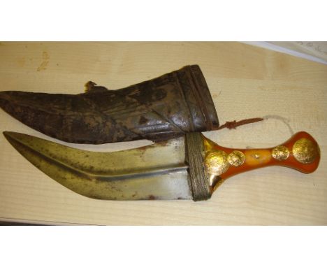Vintage jambiya blade in leather sheath length 18 cms overall length 30 cms 