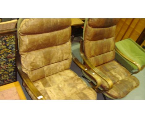 Pair of 1970's revolving leather chairs by Scarlet