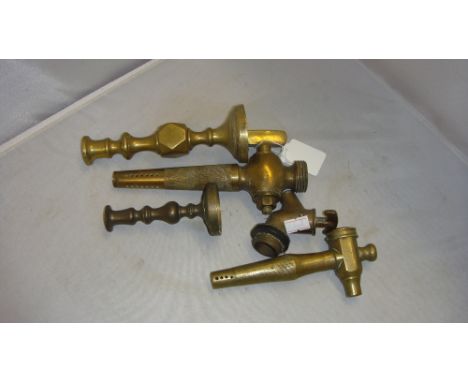 Vintage brass beer spigot / taps ( one by Stock & Sons ? makers mark rubbed ) and brass candle sticks