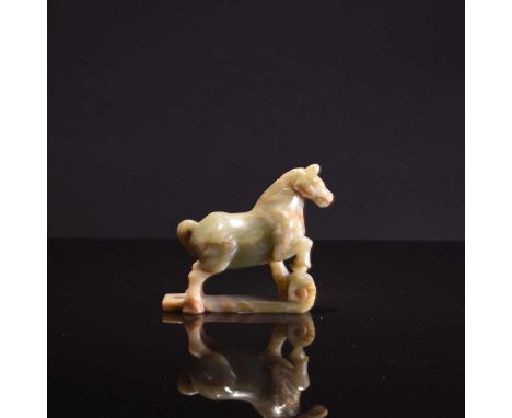 A Chinese jade figure of a standing horse, late Qing DynastyThe celadon stone with russet inclusions modelled in the 17th cen