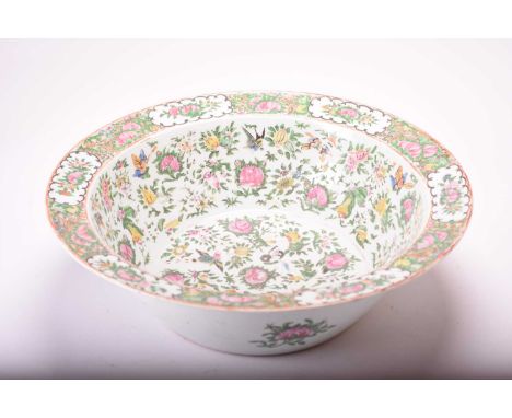 A Chinese Canton famille rose punch bowl, 19th centuryDecorated with roses, auspicious fruits, fanciful birds and butterflies