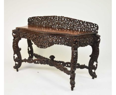 A 19th century Burmese carved rosewood side table, 19th centuryProfusely carved with stiff leaf foliage and acanthus, the sha