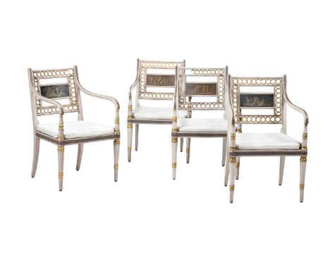 A SET OF FOUR GEORGE III PAINTED OPEN ARMCHAIRS IN THE MANNER OF THOMAS CHIPPENDALE THE YOUNGER, CIRCA 1810each 88cm high, 57
