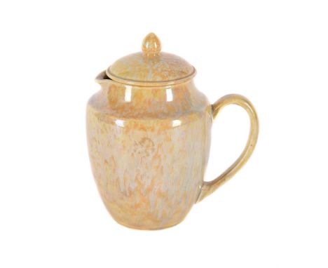 A RUSKIN POTTERY YELLOW LUSTRE LOW-FIRED MILK JUG AND COVER CIRCA 1927-1933 with a streaked yellow glaze impressed marks 'RUS