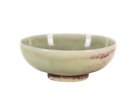 A RUSKIN POTTERY HIGH-FIRED SMALL BOWL DATED 1911 with flambé glaze on a mottled pale celadon ground impressed marks 'RUSKIN 