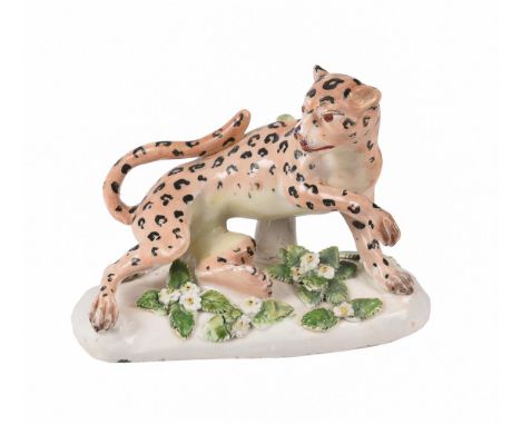 A DERBY PORCELAIN MODEL OF A CHEETAH  CIRCA 1790 The feline modelled on a flower encrusted base Unmarked9.5cm high, 12.5cm wi