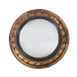 A REGENCY GILTWOOD CONVEX WALL MIRROR
