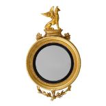 A REGENCY GILTWOOD CONVEX WALL MIRROR