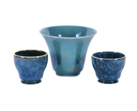 TWO UNUSUAL RUSKIN POTTERY LOW-FIRED EGG CUPS CIRCA 1927-1933 with mottled blue and green glazes and A RUSKIN POTTERY LOW-FIR