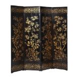 A CHINESE BLACK LACQUER AND GILT DECORATED FOUR-FOLD SCREEN