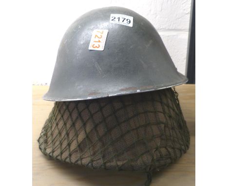 Two Russian post war helmets with liner and chinstrap, one with cover and net. P&amp;P Group 2 (£18+VAT for the first lot and