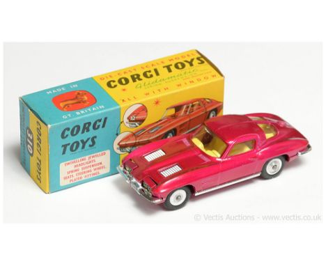 Corgi a boxed 310 Chevrolet Corvette Sting Ray in metallic cerise, yellow interior, chrome trim and spun hubs. Conditions gen