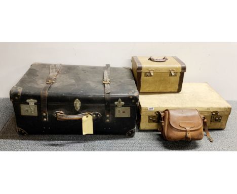 A 1920's pigskin suitcase, 61 x 36 x 18cm, together with a leather trunk, leather bag and Skyline case.