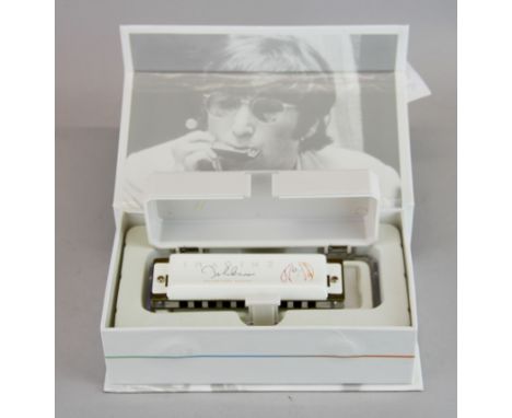 A Hohner Imagine John Lennon signature series harmonica.