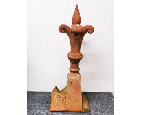 A large terracotta roof ridge finial, H. 102cm.
