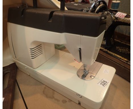 Electric Singer sewing machine with manual model 7101