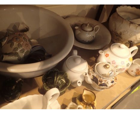 Shelf of mixed ceramics 