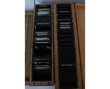 An excellent collection of vintage glass negative plate photograph slides set within 2 wooden box. To include landscapes, arc