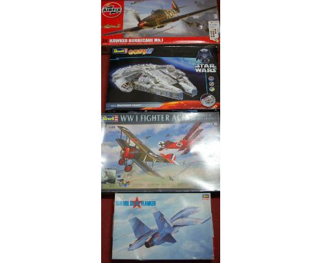 Four various military and sci-fi related plastic kits to include a Revel Easy Kit Milennium Falcon, a Hassagower 1/72 scale S
