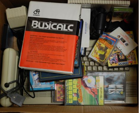 A collection of Commodore 64 computer games and accessories, to include control unit, Commodore recorder, various games to in