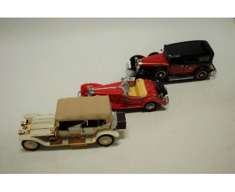 Three various boxed Franklin Mint 1/24 scale diecasts to include a 1935 Mercedes 770K Rossa, a 1911 Rolls Royce, and a 1935 M