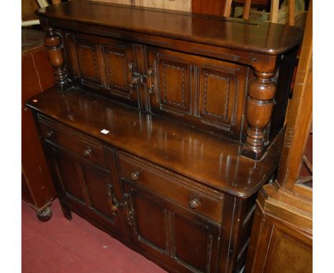 An Ercol dark elm court cupboard, width 122cm