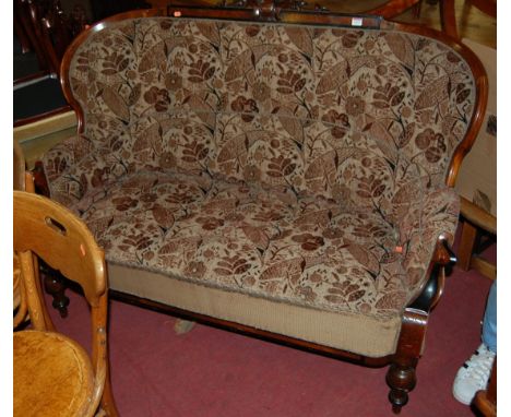 A late Victorian oak and walnut framed floral upholstered two seater parlour sofa, width 145cm