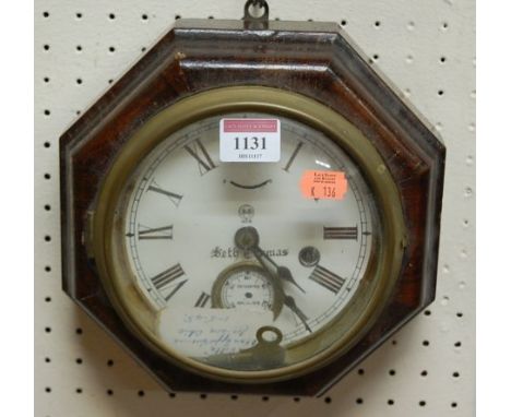 An early 20th century American walnut octagonal wall clock, the white enamel dial signed Seth Thomas 