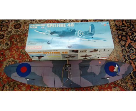 A collection of radio controlled model aircraft equipment to include a boxed Supermarine Spitfire 40 by Kyosho, a quantity of