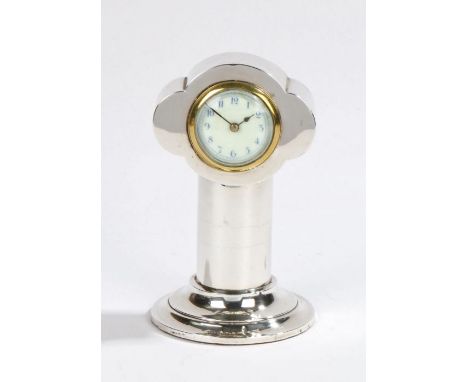 Art Nouveau silver desk timepiece, Birmingham 1908, maker Henry Clifford David, the shaped case above a wide stem and stepped
